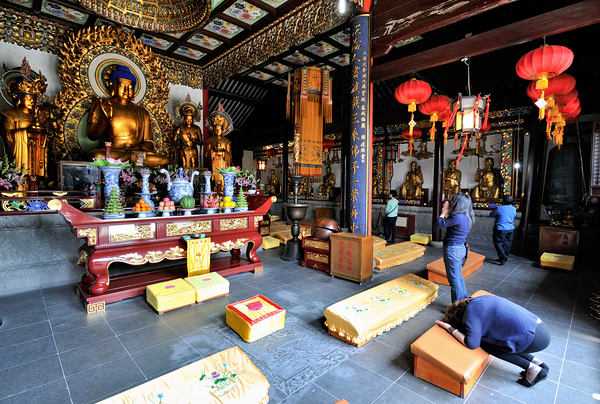 Worshippers offer prayers in a Buddhist temple in Shanghai Chin Digital Download