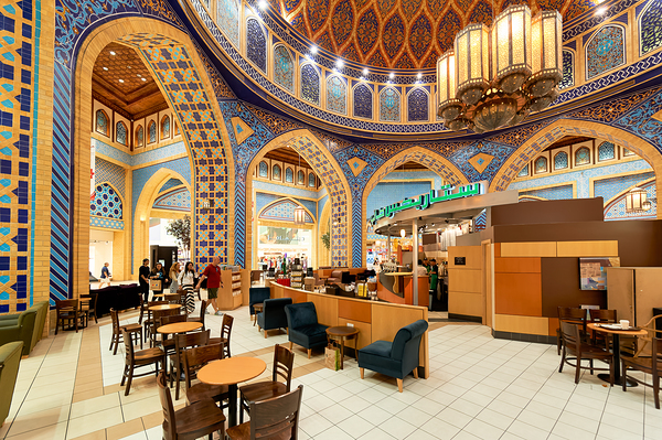 Starbucks store in decorated mall with customers in Dubai UAE Digital Download