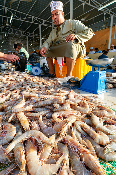 Fish market in Muscat Oman shows vendor and fresh catch Digital Download