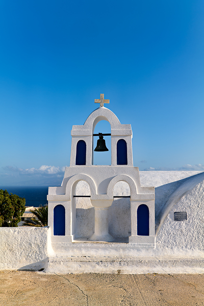 White bell tower against blue sky and sea. Digital Download