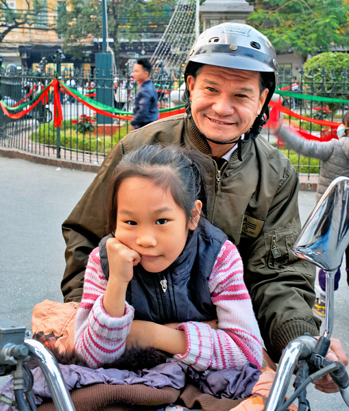 Grandfather and granddaughter share a moment in Hanoi Digital Download