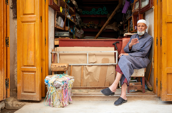 Old man in second hand shop at medina in Fez Morocco Digital Download