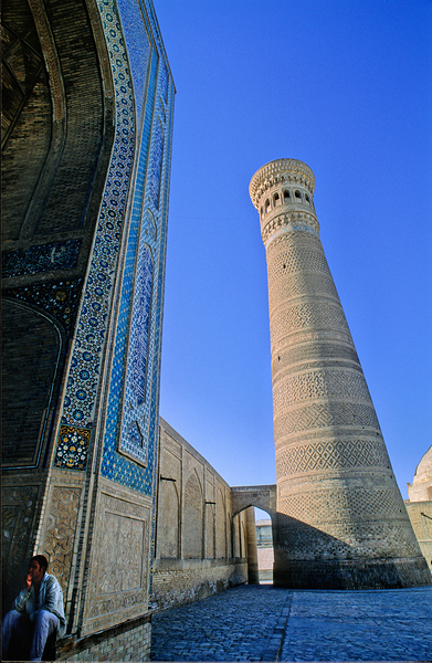 People rest near the tall minaret in Khiva Uzbekistan Digital Download
