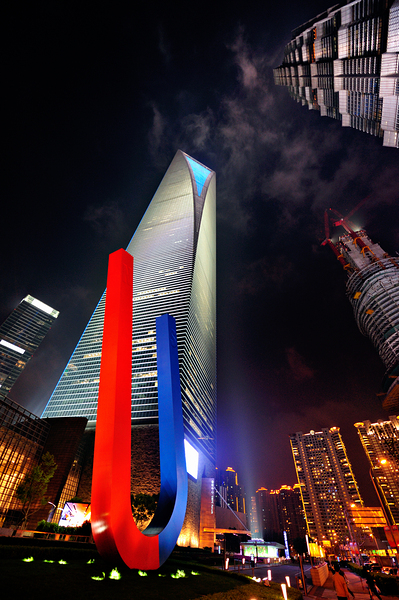 Luminous Shanghai skyscrapers and abstract sculpture at night Digital Download