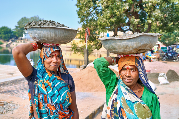 Women carry materials in Varanasi near the river bank Digital Download