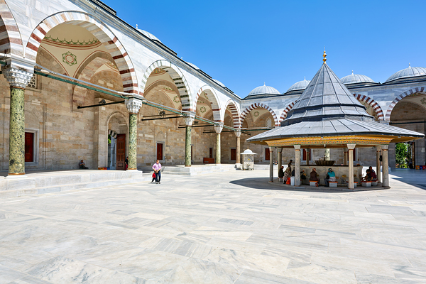 Visitors explore the courtyard at Fatih Mosque in Istanbul Digital Download