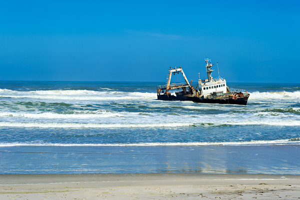 Shipwreck on the Skeleton Coast of Namibia under clear blue sky Digital Download