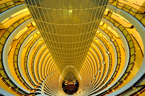 Golden hotel atrium with glass elevator in Shanghai China Digital Download