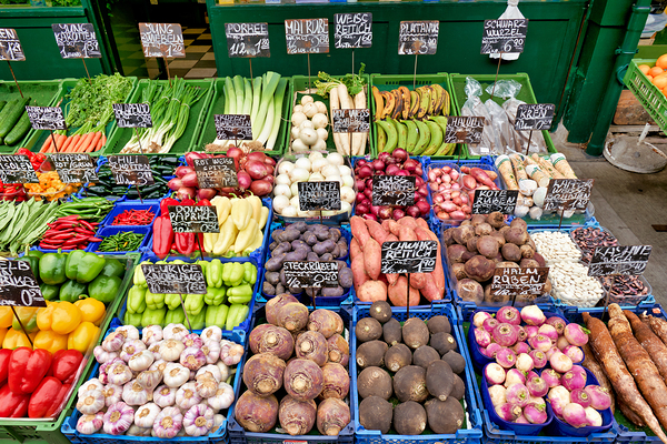 Colorful fresh vegetables and fruits displayed at a market stall Digital Download