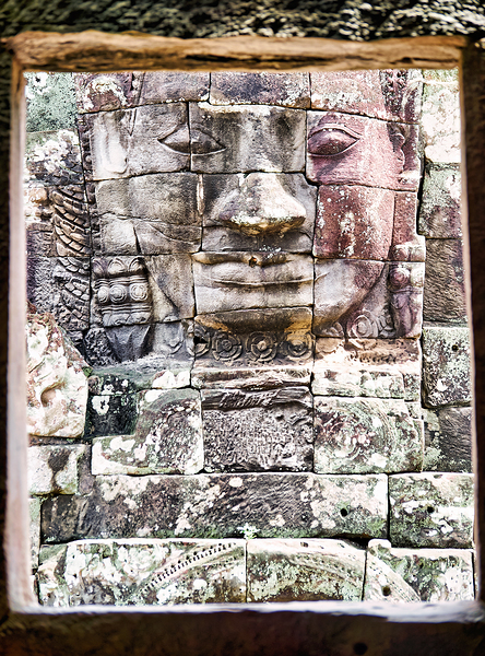 Ancient stone face carving framed in temple window. Digital Download