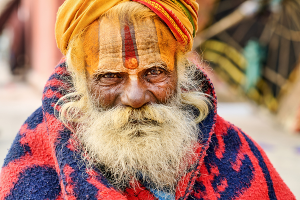 Old holy man in Varanasi wearing bright colors in Uttar Pradesh Digital Download