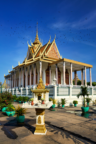 Majestic Cambodian temple under a blue sky with flying birds. Digital Download