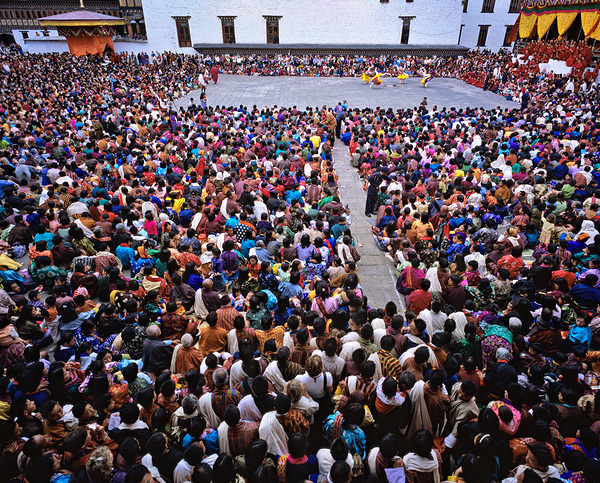 Large crowd watches traditional dance performance at outdoor fes Digital Download