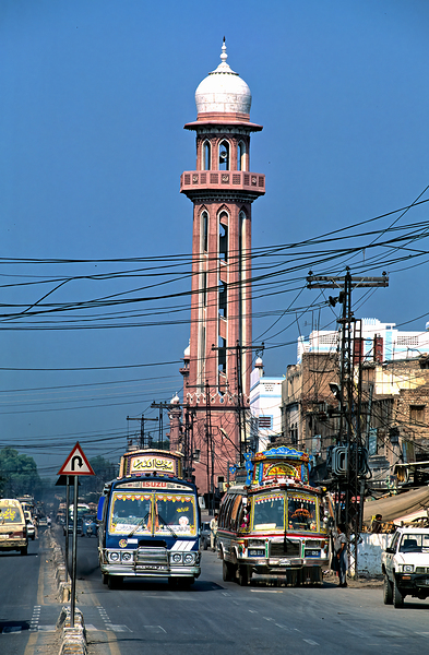 Busy street scene with tall tower in Peshawar Pakistan Digital Download