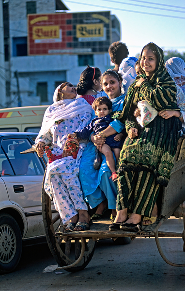 Family travels on rickshaw in busy Lahore streets Digital Download
