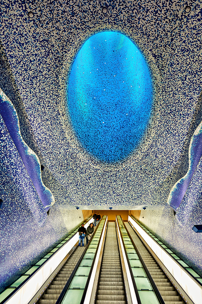 People travel down escalators at Toledo station in Naples Metro Digital Download