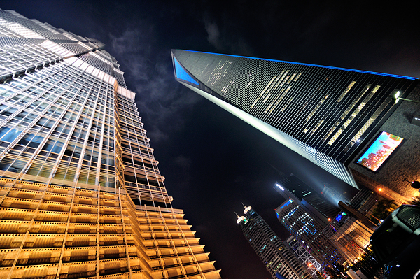 City skyline with skyscrapers shining bright in Shanghai at nigh Digital Download