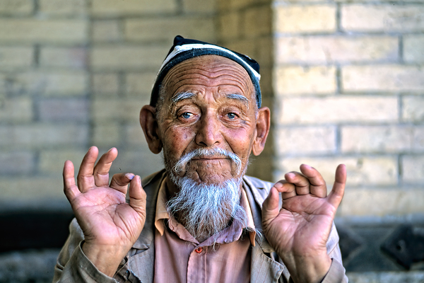 Elderly man showing hand gestures in Khiva Uzbekistan Digital Download