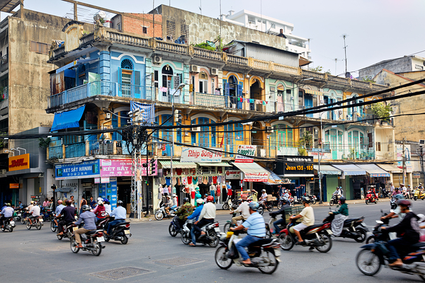 Busy street scene in Ho Chi Minh City with motorbikes and shops Digital Download