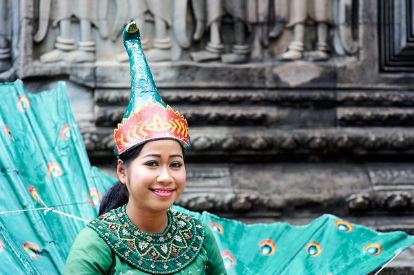 Smiling Cambodian dancer in traditional peacock costume at templ Digital Download