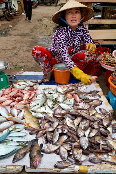 Fish seller in Phu Quoc market shows fresh catch for sale Digital Download