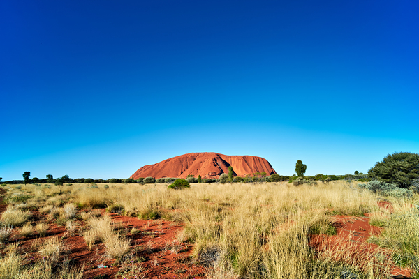 Uluru Australias iconic sandstone monolith under a clear blue Digital Download