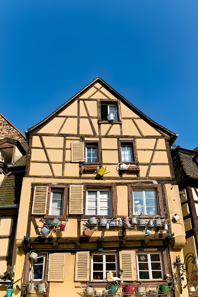 Timber framed houses in Colmar with clear blue sky above Digital Download