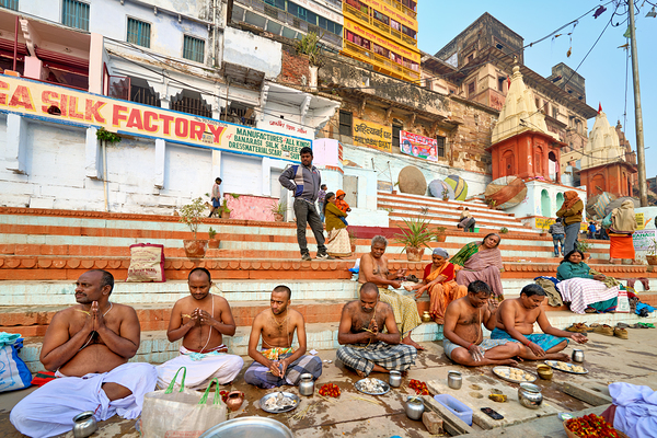 Barechested men offer prayers by the Ganges River in Varanasi Digital Download