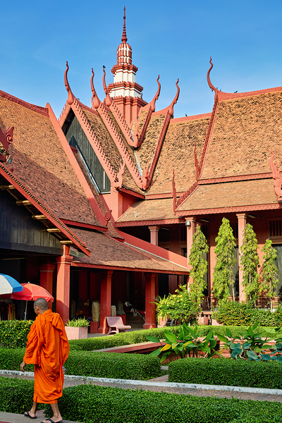 Monk walks through traditional Cambodian temple garden. Digital Download