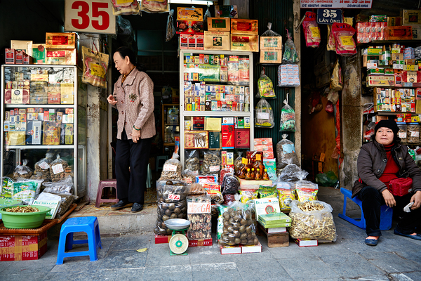Market scene with vendors selling goods in Hanoi Digital Download