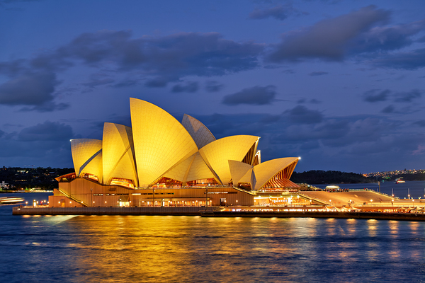 Sydney Opera House illuminated at dusk with harbor lights. Digital Download