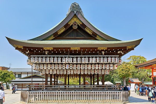 Visitors admire Yasaka shrine in Kyoto during sunny day Digital Download