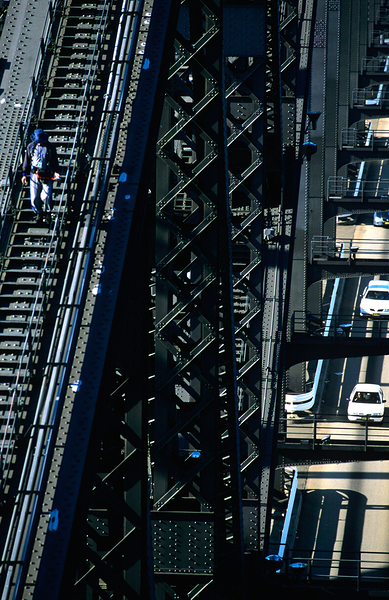 Man walks on bridge with cars below Digital Download