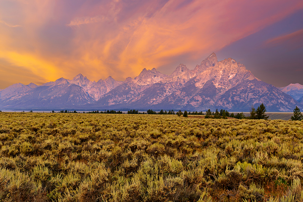 Hikers explore view of Grand Teton mountains at sunset Digital Download