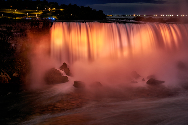 Niagara Falls illuminated orange at night. Digital Download