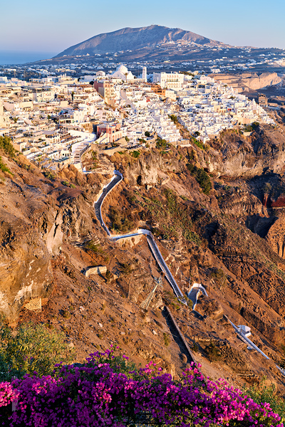 Picturesque Santorini cliffside town with winding path and vibra Digital Download