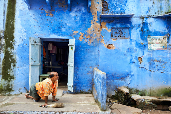Man sweeps in front of home in Bundi Rajasthan during the day Digital Download