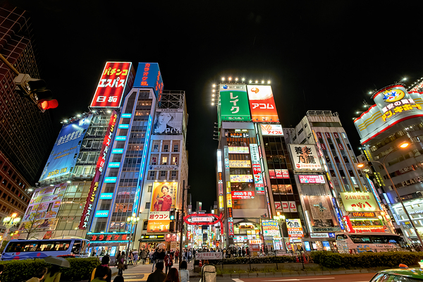 Neon lights shine bright in Shinjuku district of Tokyo at night Digital Download