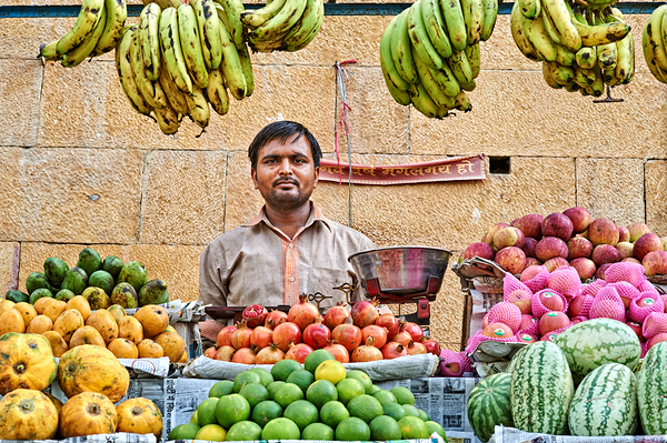Fruits and vegetables stall in Jaisalmer with vendor at work Digital Download