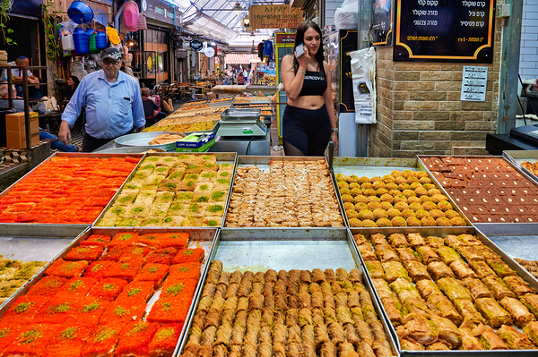Visitors explore food stands at Mahane Yehuda Market in Jerusale Digital Download