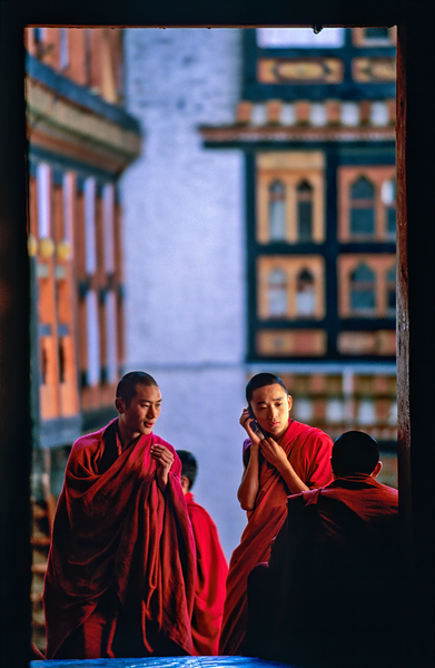 Bhutanese monks using a mobile phone. Digital Download