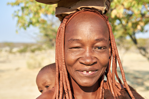 Namibia. Portrait of a smiling Himba woman with her baby in Kunene region Digital Download