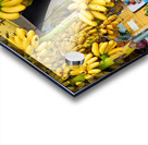 Market vendor surrounded by abundant yellow bananas. Acrylic print