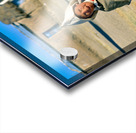 Indigenous boy with tools walks through a dusty village. Acrylic print