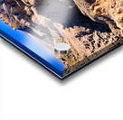 Hikers traverse a vast arid rocky desert landscape. Acrylic print