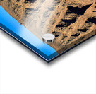 Hiker traverses a dramatic shadowed desert landscape. Acrylic print