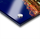 People walk across the Helix Bridge as the Marina Bay Sands Hotel shines at sunset. The sky turns orange and lights reflect in the water. Acrylic print