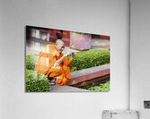 A buddhist monk taking a picture at the National Museum of Cambodia in Phnom Penh Acrylic Print