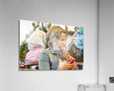 Syria. Aleppo. Girl smoking hookah and looking at her smartphone Acrylic Print