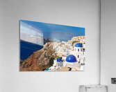 Santorinis iconic white buildings and blue domes overlooking th Acrylic Print